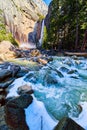 Cascading icy falls over frosty walks with rainbow next to Lower Yosemite Falls Royalty Free Stock Photo