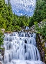 Cascading stream in Mt. Ranier National Park with sky Royalty Free Stock Photo