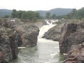 Cascading of water of river Kaveri at Hogenakkal Falls between rocks Royalty Free Stock Photo