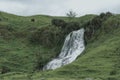 Cascading waterfall, adorning the natural beauty of the scene