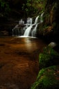 Cascading waterfall in lush bush land Australia