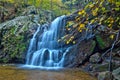 Cascading woodland waterfall and fall foliage