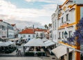 Busy touristic restaurants and bars area in the center of Cascais with traditional Portuguese architecture