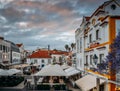 Busy touristic restaurants and bars area in the center of Cascais with traditional Portuguese architecture