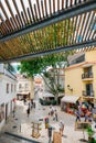 Busy touristic restaurants and bars with traditional Portuguese architecture