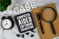 CASE Computer Aided Software Engineering text with alarm clock and magnifying glass on marble background Royalty Free Stock Photo
