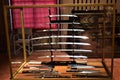 Case, containing samurai swords, some without handles, in a room of Villa Stibbert, in Florence.