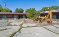 A Case front loader in the overgrown parking lot of an abandoned motel in Wells, Nevada, USA - June 18, 2022