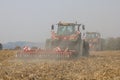 Tractors working on corn field in Czech Republic