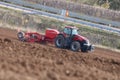 Case IH magnum tractor working beside highway in Germany Royalty Free Stock Photo