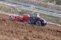 Case IH magnum tractor working beside highway in Germany