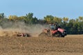 Case IH 580 Quadtrac tractor pulling a Horsch Joker RT32 disc/crumbler across a pumpkin field