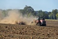 Case IH 580 Quadtrac tractor pulling a Horsch Joker RT32 disc/crumbler across a pumpkin field Royalty Free Stock Photo