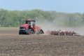 Case IH Steiger 580 Quadtrac pulling a Case yield-till system cultivator for spring planting