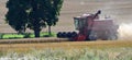 Case International Combine Harvester at work creating a lot of dust. Royalty Free Stock Photo