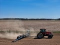 Case 7240 tractor pulling a .Kinze 3205 12 row planter planting corn Royalty Free Stock Photo