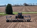 Case 7240 tractor pulling a .Kinze 3205 12 row planter planting corn Royalty Free Stock Photo