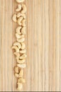 Cases a band of cashew lying on bamboo mat Royalty Free Stock Photo