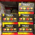 Cases of cans of Truly Flavored Hard Lemonades at a Sams Club grocery store waiting for customers to purchase