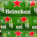 Cases of Heineken Bottle Beer at a grocery store waiting for customers to purchase. Heineken is a product of Holland