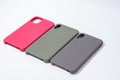 Cases for smartphones in different colors on a white background.