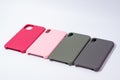 Cases for smartphones in different colors on a white background.