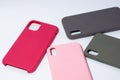 Cases for smartphones in different colors on a white background.