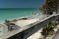 Casey Key coastline and wooden barrier on the road towards Siesta Key