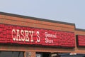 Casey`s General Store with an Advertisement sign shot closeup on a summer day.