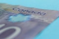 Cash bills from Canadian currency. Dollars. Bills on colorful bright table