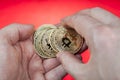 Cash coin internet currency Bitcoin lies in human palm, closeup