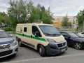 Cash collection van in the parking lot near the store. Front view.