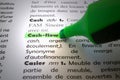 Cash flow highlighted in a French dictionary Royalty Free Stock Photo