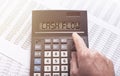 CASH FLOW word on calculator on financial documents with male hand Royalty Free Stock Photo