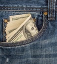 Cash in the front pocket of blue jeans Royalty Free Stock Photo