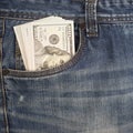 Cash in the front pocket of blue jeans closeup Royalty Free Stock Photo