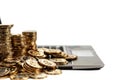 Cash and gold coins piles on a laptop for electronic banking and making money online Royalty Free Stock Photo