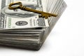 Cash and Key for Wealth and Riches Royalty Free Stock Photo