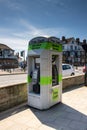 Cash machine and public phone box in the town centre of Skegness in the UK Royalty Free Stock Photo