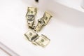 Cash Money Going Down Sink Drain Isolated on White Background Royalty Free Stock Photo