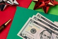 Cash money and holiday greeting cards.