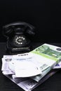 cash and old black phone with boarding card Royalty Free Stock Photo