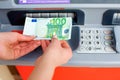 Cash out money at an ATM Royalty Free Stock Photo