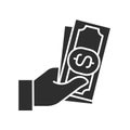 Cash payment black glyph icon. Hand holds money. Pictogram for web page, mobile app, promo. UI UX GUI design element Royalty Free Stock Photo