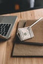 cash payment lying on notepads near laptop on tabletop in cafe Royalty Free Stock Photo