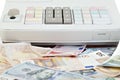 Cash register and different paper currencies