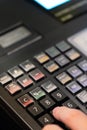 cash register installed on counter for accepting order from customer.sales man entering amount on electronic cash register in Royalty Free Stock Photo