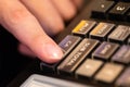 cash register installed on counter for accepting order from customer.sales man entering amount on electronic cash register in Royalty Free Stock Photo