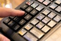 cash register installed on counter for accepting order from customer.sales man entering amount on electronic cash register in Royalty Free Stock Photo