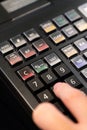 cash register installed on counter for accepting order from customer.sales man entering amount on electronic cash register in Royalty Free Stock Photo